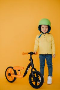 Best Kids Tricycles of Top Brands - Kids with Helmet - baby bicycles or kids tricycles or balance bike